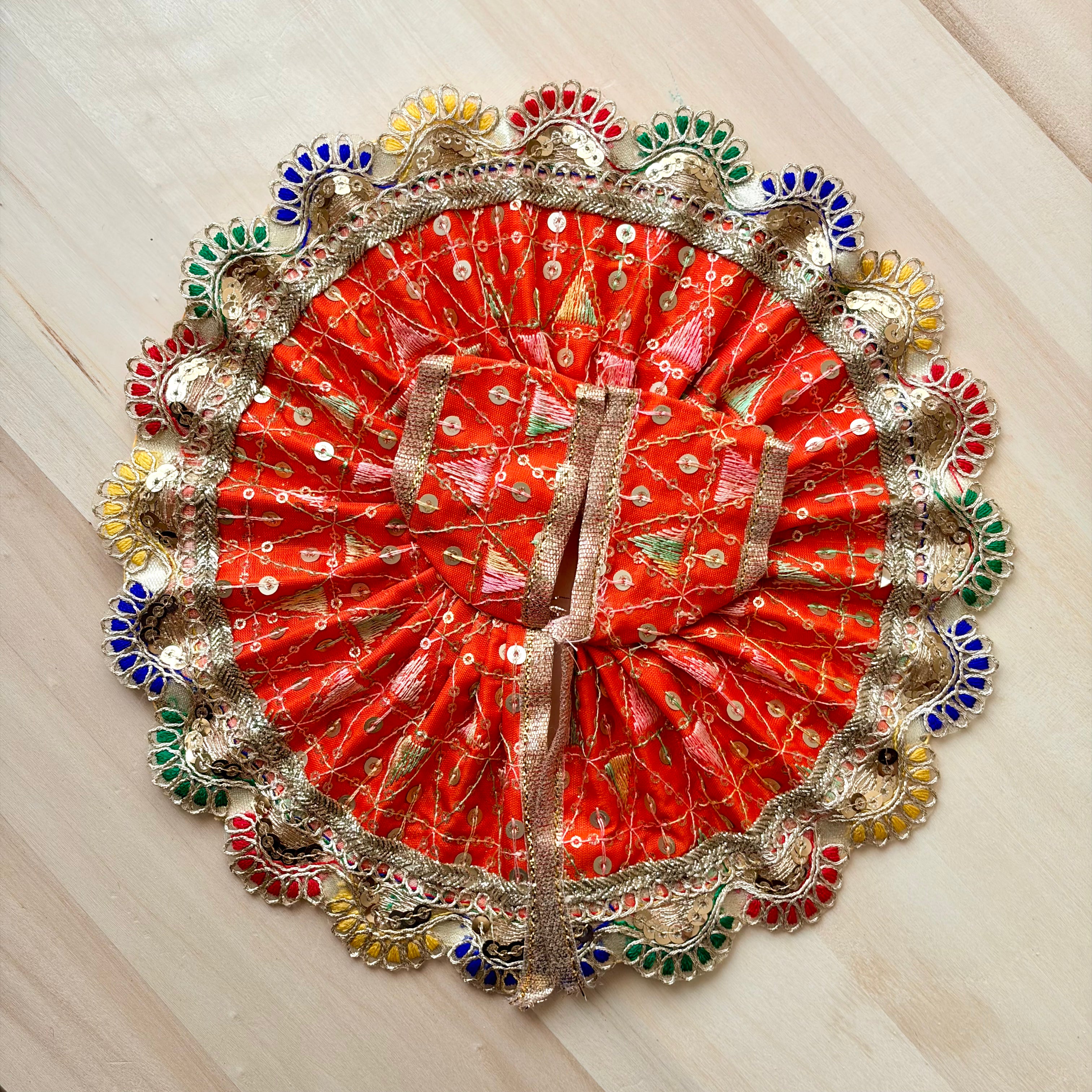 Multi colour border and red base Laddu Gopal dress for festive shringar in premium fabric with decorative detailing