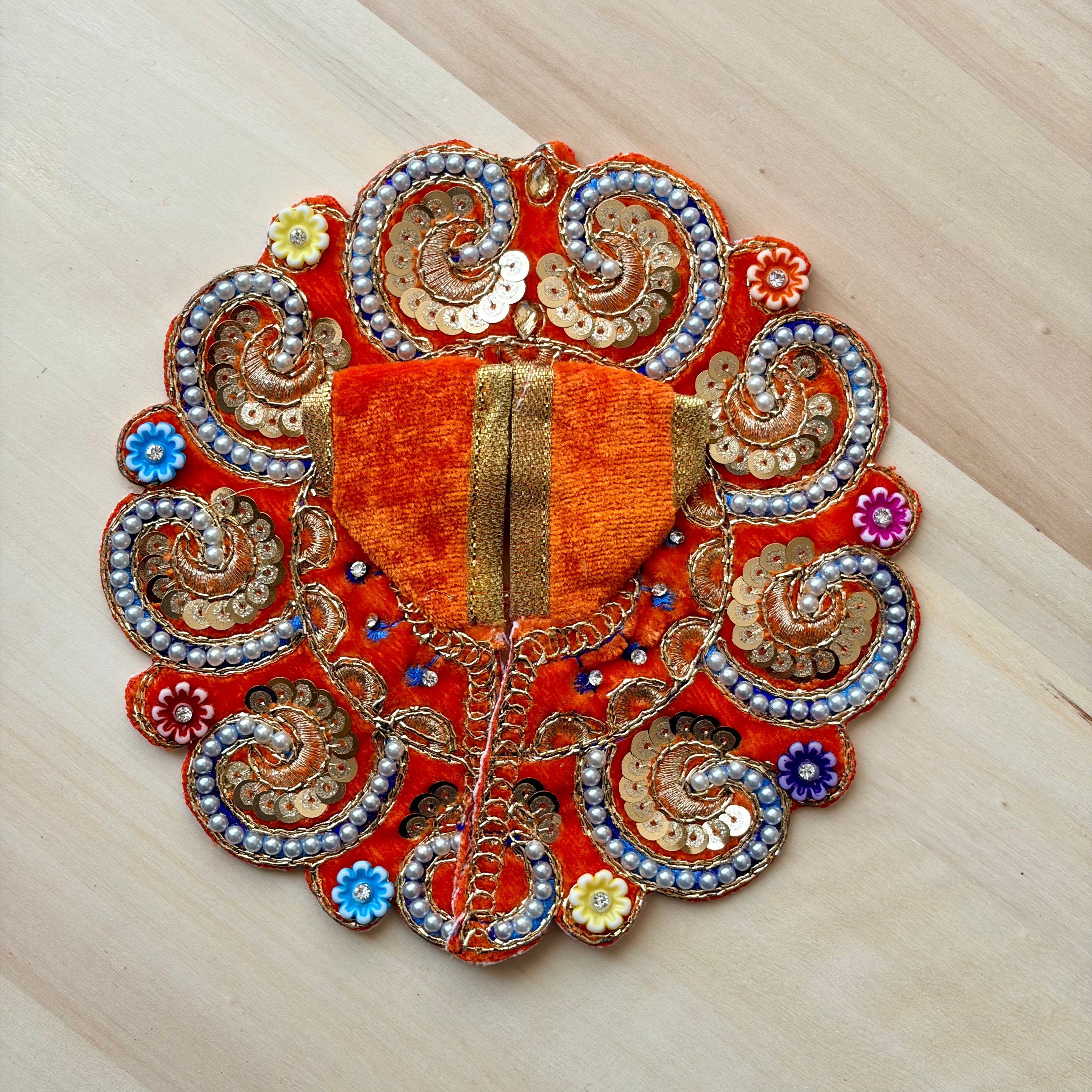 Orange Laddu Gopal dress with flowers for festive shringar in premium fabric with decorative detailing