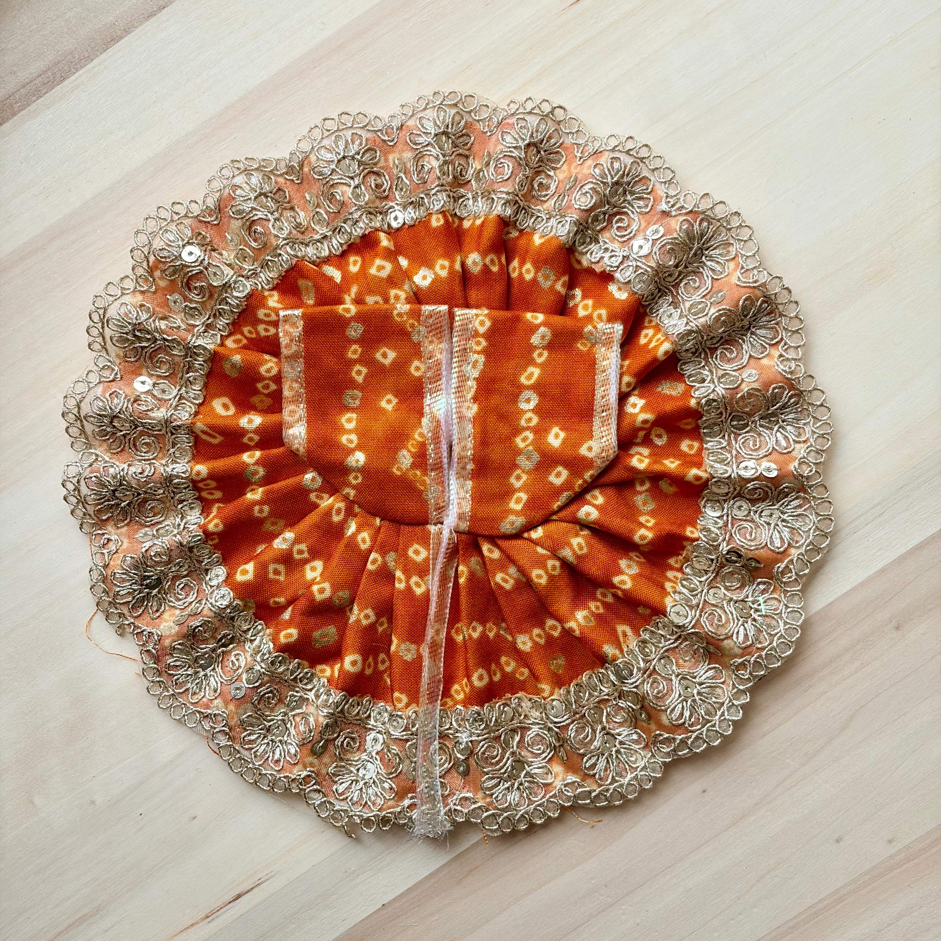 Orange bandhani Laddu Gopal dress for festive shringar in premium fabric with decorative detailing