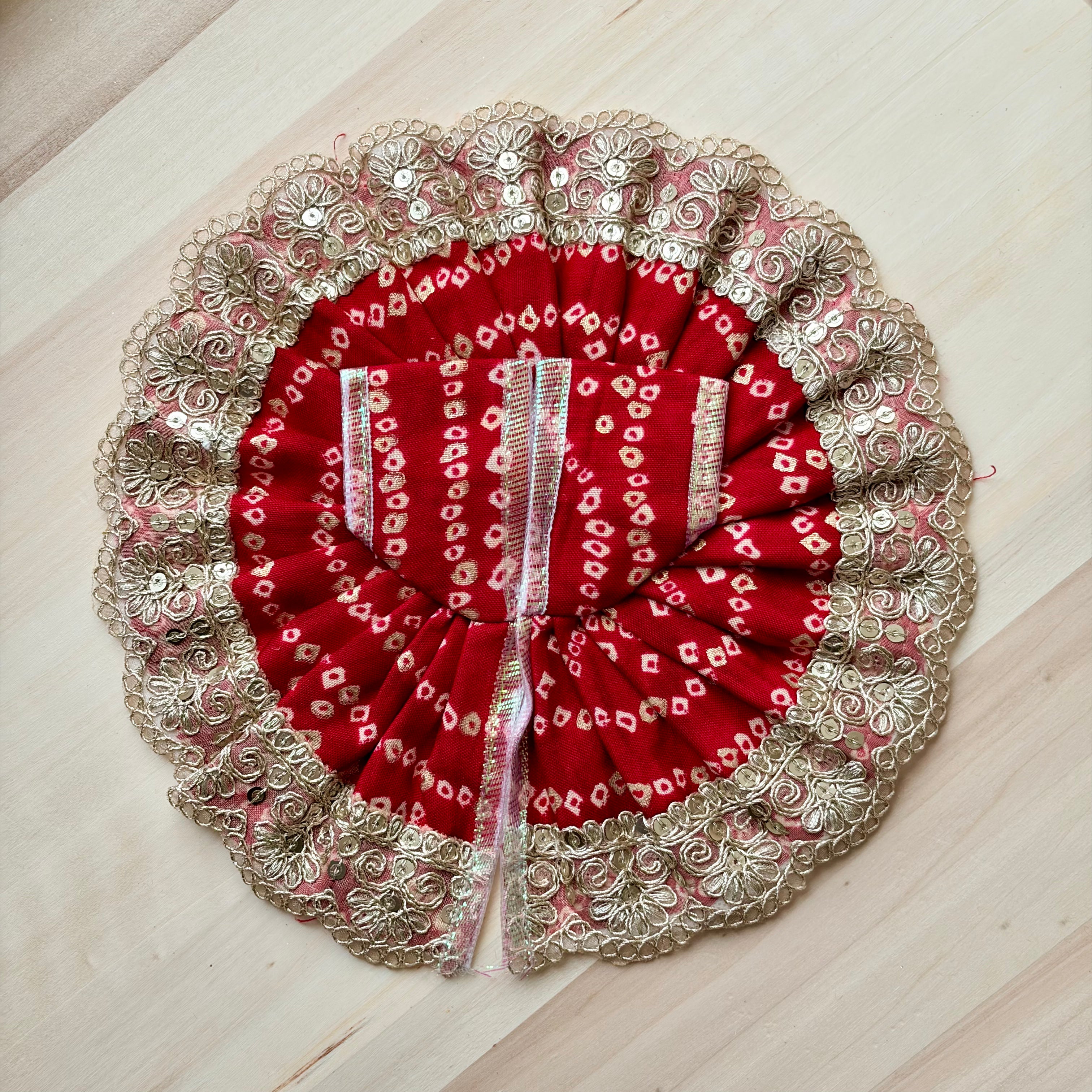 Red bandhani Laddu Gopal dress for festive shringar in premium fabric with decorative detailing